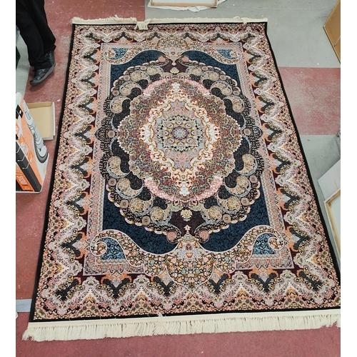 1530 - Expada Tassled Polyester Rug, allover heavilly decorated in many colours with central cartouche, bla... 