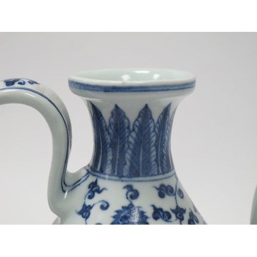 1203 - Crown Devon 'Widdecombe Fair' Musical Jug, Oriental ewer in blue and white pottery, 22.5cm high. (2)... 