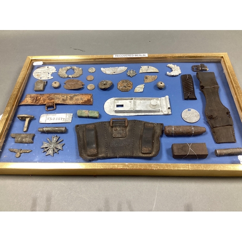 421 - WWII German Third Reich Relics, including remnants of identification discs, buttons, ammunition pouc... 