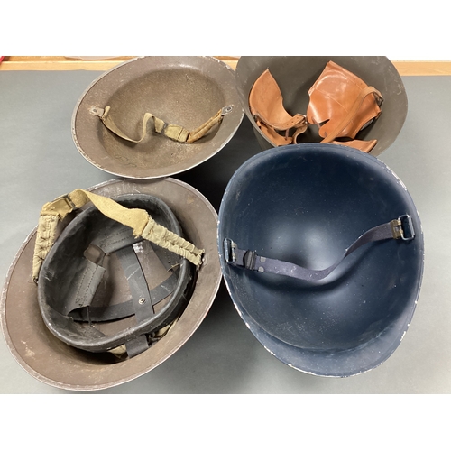 545 - WWII British Brodie Helmets (x 2), one has liner and chin strap, other chin strap only, US MI helmet... 