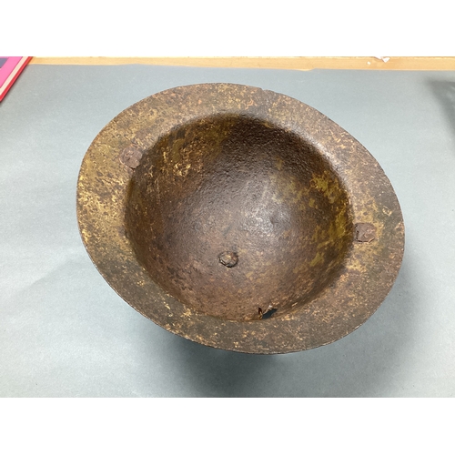 557 - WWI British Army Raw Edge Brodie Helmet, with shrapnel hole, shell only, semi relic condition.