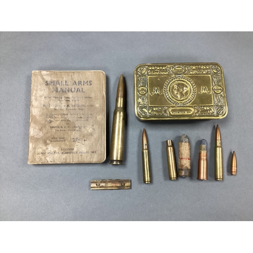 566 - WWI Princess Mary 1914 Gift Fund Box, various inert ammunition and WWII small arms manual.