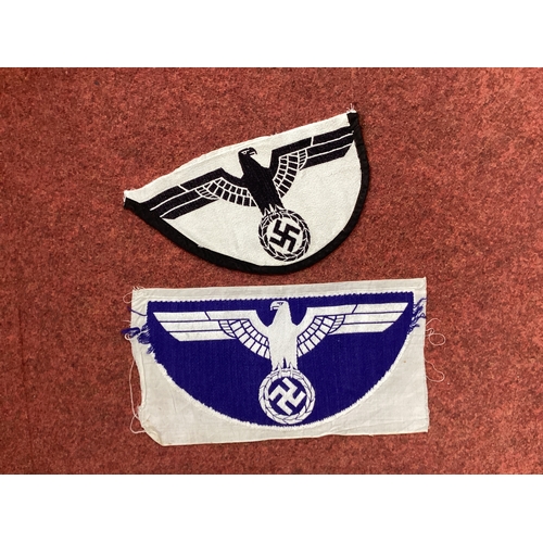 580 - WWII German Third Reich Sports Vest Eagles, comprising uncut blue Kriegzsmarine sports vest eagle on... 