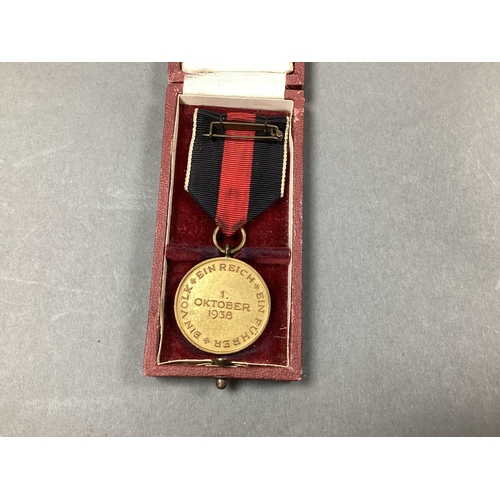 638 - Interware German Third Reich Sudetenland Medal, in a presentation case.