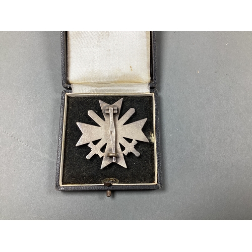 700 - WWII German Third Reich War Merit Cross, with swords, 1st Class, manufacturer mark on pin L15, in pr... 