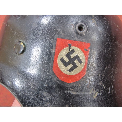 563 - WWII German Third Reich M42 Helmet, black paint finish to exterior and green paint finish to interio... 