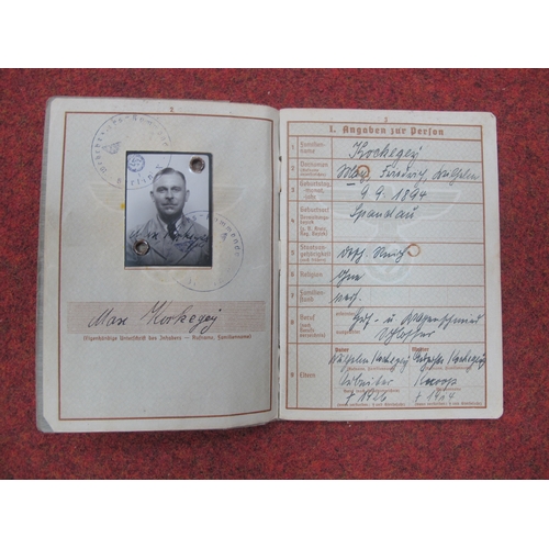 607 - WWII German Third Reich Ephemera, including service books (x 2), work books (x 2), driving licences,... 