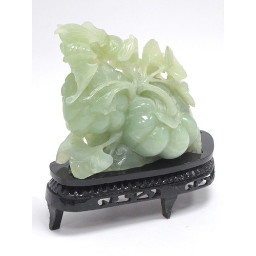 1153 - A Mid/Late XX Century Jadeite Carving of Gourds, hardwood stand, 19cmm high.