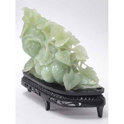 1153 - A Mid/Late XX Century Jadeite Carving of Gourds, hardwood stand, 19cmm high.