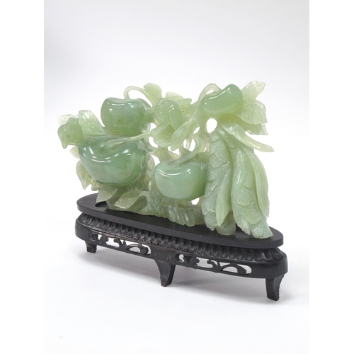 1154 - A Mid/Late XX Century Jadeite Carving of a Fruiting Tree, hardwood stand, 16cm high.