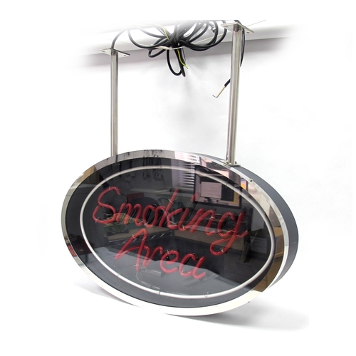 1342 - A Modern Neon Sign 'Smoking Area', with red lettering in a chrome oval display, no transformer, with... 