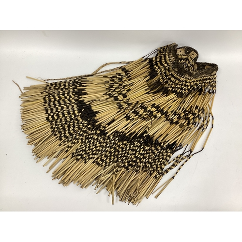 1348 - A Vintage Long Maori Grass Skirt, with woven waist band, approximately 64cm long.