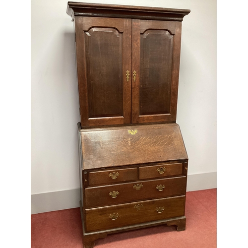 1485 - A Georgian Oak Bureau Bookcase, with twin panelled doors over fall front, fitted interior over two s... 