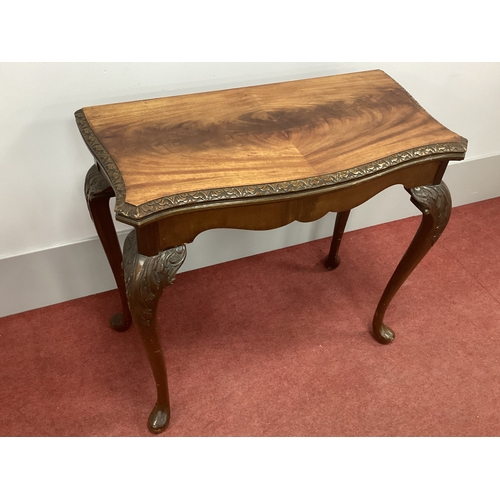 1493 - A XX Century Serpentine Shaped Card Table, with fold-over top, on carved cabriole legs and pad feet,... 