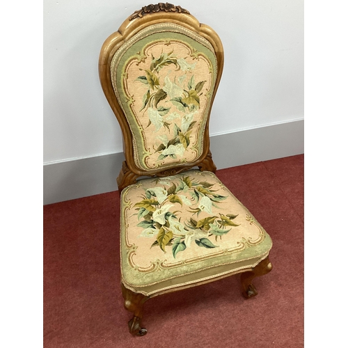 1499 - A XIX Century Walnut Chair, with carved top rail, floral woolwork back and seat, on cabriole legs.