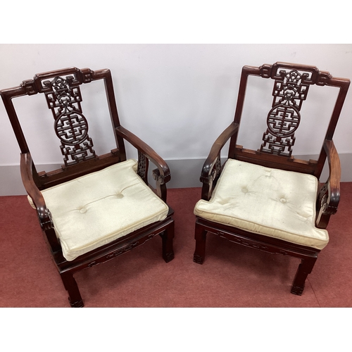 1502 - A Pair of Chinese Hardwood Open Armchairs, with pierced splats, shaped arm supports and panelled sea... 