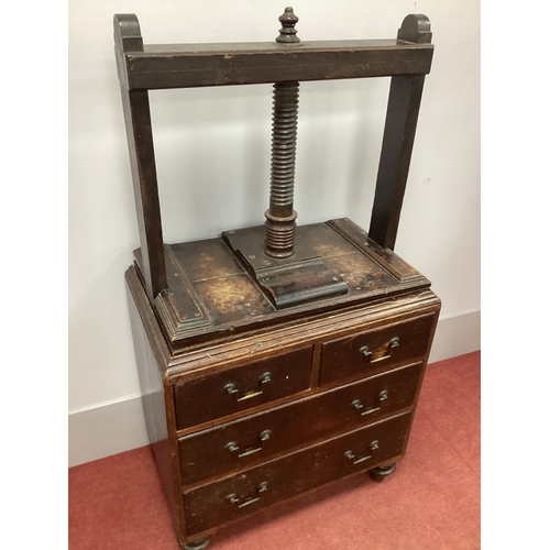 1530 - A XIX Century Oak Book Press, with spiral thread and turned arm, two short and two long drawers, on ... 