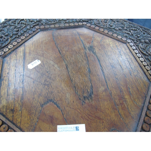 1336 - An Anglo India Carved Hardwood Camel Table, circa 1900, the top and base of octagonal form and carve... 