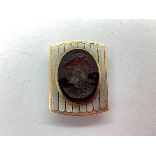 113 - A Roman Intaglio Style Dress Stud, the oval panel carved depicting Roman portrait, set to centre wit... 