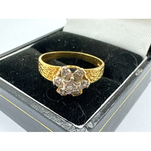 132 - An 18ct Gold Diamond Cluster Ring, the brilliant cut diamonds illusion set within flowerhead cluster... 