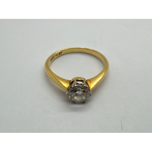 134 - A Single Stone Diamond Ring, the round brilliant cut stone (6mm) claw set, between tapered shoulders... 