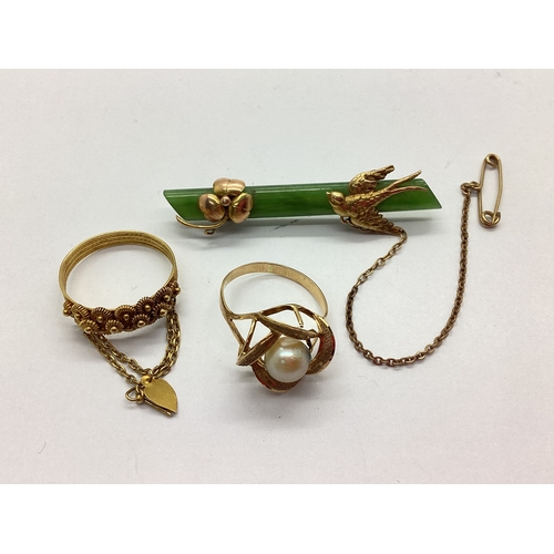 150 - A Green Hardstone Panel Bar Brooch, with applied three leaf clover and swallow decoration, stamped 