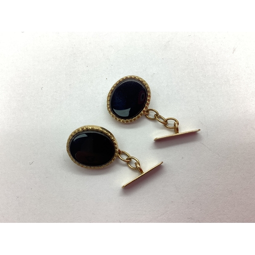 152 - A Pair of 9ct Gold Inlaid Cufflinks, the oval panels with scalloped border, on chain connections to ... 