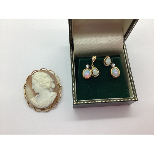 163 - A Pair of 9ct Gold Opal and Diamond Set Earrings, the oval opal collet set to diamond set surmount, ... 