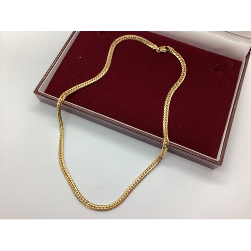 76 - A 9ct Gold Flat Curb Link Chain, London import mark, 41cm long (9.4grams).