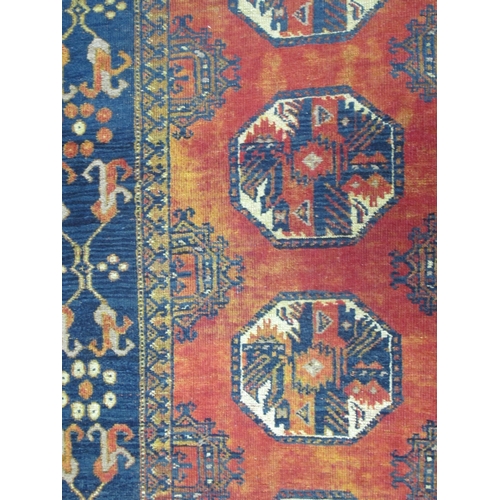 1519 - Middle Eastern Wool Runner, with eight octagonal motifs, to rust grounded centre within blue decorat... 