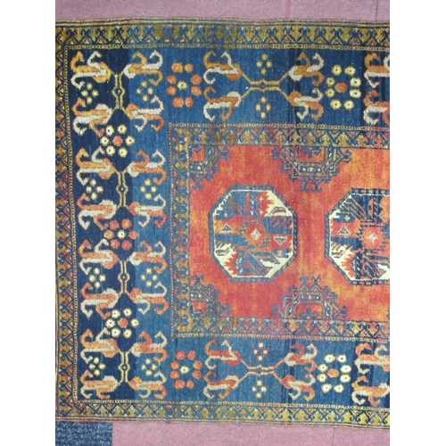 1519 - Middle Eastern Wool Runner, with eight octagonal motifs, to rust grounded centre within blue decorat... 