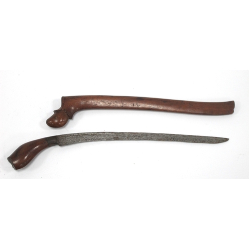 1338 - Kris - Indonesian/Malayan, with silvered blade, ornately carved wooden handle, 47cm long in tomahawk... 