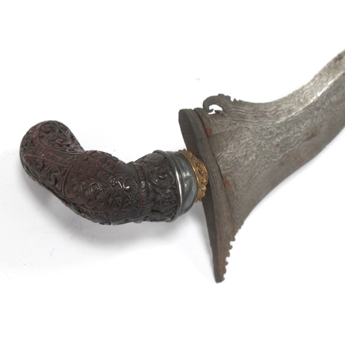 1338 - Kris - Indonesian/Malayan, with silvered blade, ornately carved wooden handle, 47cm long in tomahawk... 