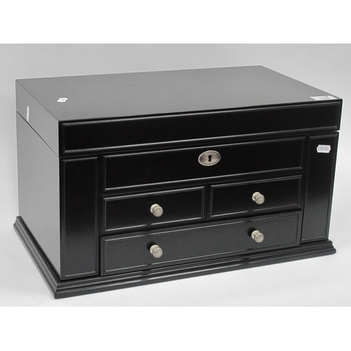 1268 - Ladies black ebonised jewellery box with a hinged lid and sides, fitted interior, three drawers, tog... 