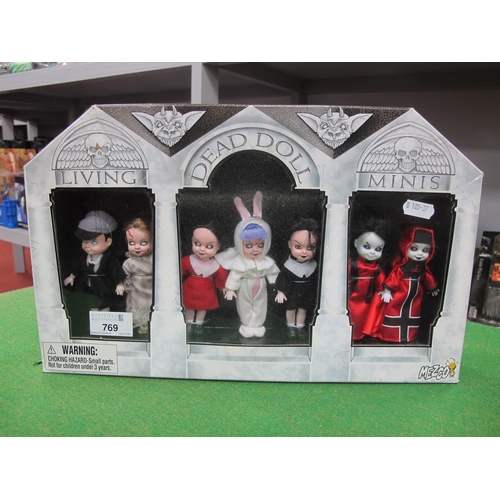 769 - A Boxed Set of Seven Living Dead Doll Minis by Mezco.