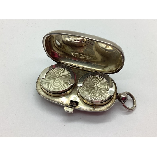 24 - A Hallmarked Silver Sovereign Case, WHH, Birmingham 1914, of oval form with allover chased foliage d... 