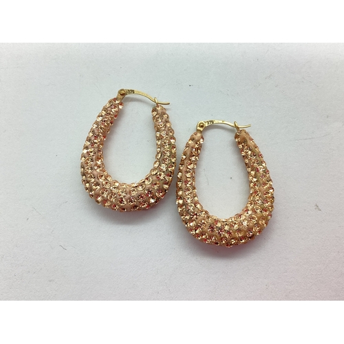 52 - A Pair of Pink Coloured Diamanté Set Hoop Earrings, to hinge top backs stamped 