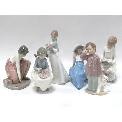 1201 - Nao figurines to include Girl playing marbles, A gift from the heart, Girl writing on blackboard, th... 