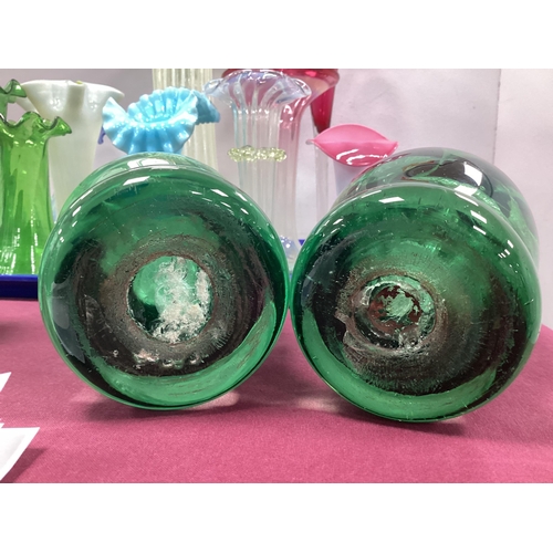 1213 - A Pair of Late XIX Century Green Glass Dump Paperweights, with flowerhead inclusions, 16cm high. (2)... 