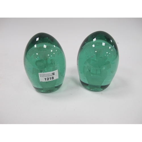 1218 - A Pair of Late XIX Century Green Glass Dumps, with floral inclusions, 13cm high. (2) Bases rough and... 