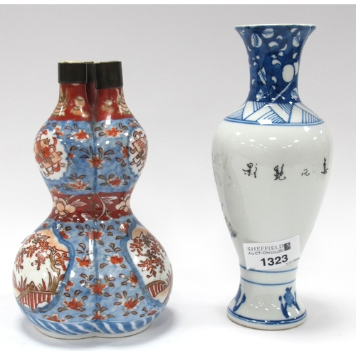 1323 - A Chinese Porcelain Vase, of baluster form, decorated with geese within blue and white borders, char... 