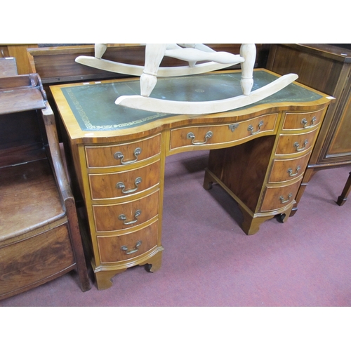 1547 - XX Century Yew Wood Serpentine Shaped Pedestal Desk, with a crossbanded top, green leather sciver, t... 