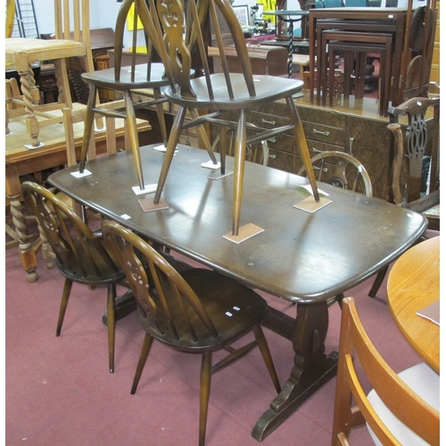 1559 - Ercol 'Old Colonial' Table - Chairs, table with a rectanglular top, shaped supports, centre rail, si... 