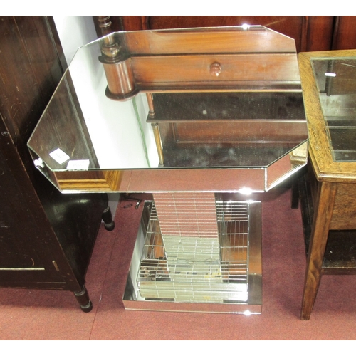 1565 - A 1930's Art Deco Mirrored Glass Coffee Table, with octagonal top and square shaped pedestal on a st... 