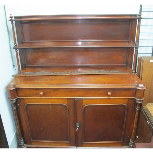 1566 - A XIX Century Mahogany Chiffonier, with panelled back, two shelves and turned columns, the base with... 