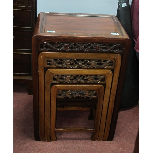 1572 - A Chinese Hardwood Quartetto Nest of Tables, with carved and pierced friezes, 49cm high. Second larg... 