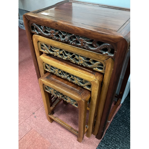 1572 - A Chinese Hardwood Quartetto Nest of Tables, with carved and pierced friezes, 49cm high. Second larg... 