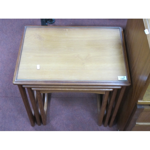 1583 - Nest of Three Teak Corner Tables with barrel shape supports and rectangular tops, the widest 53cm.