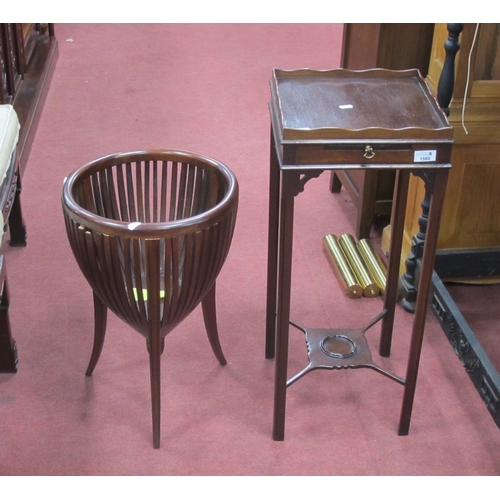 1585 - XX Century Mahogany Urn Table, with a galleried top, brushing slide, chamfered supports, corner brac... 