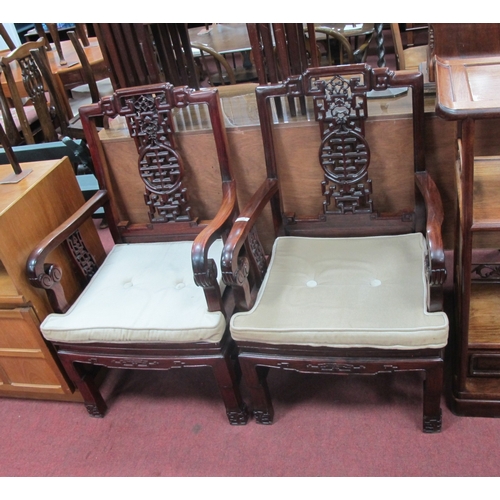 1586 - A Pair of Chinese Hardwood Open Armchairs, with pierced splats, shaped arm supports and panelled sea... 